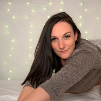 Lovely babe Clara Dee is teasing topless in thigh high socks