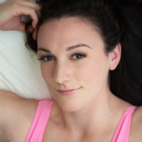 Gorgeous Clara Dee in teasing in pink bodysuit in the bedroom