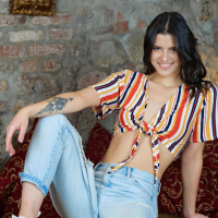 Sexy girl Viola Kat drops down her ripped jeans exposing naked curves