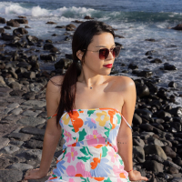 Brunette Sky Moon with hot ass showing off her shaved puss on a beach