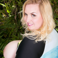 Buxom blonde beauty Nikky Wilder strips and plays with her own huge jugs