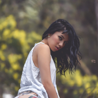 Lovely petite Latina Jessica Alvarez stripping and showing ass in the woods