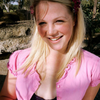 Sweet blonde babe Petal reveals her naked body outdoors
