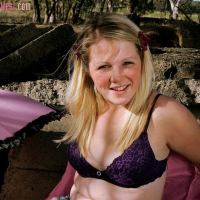 Sweet blonde babe Petal reveals her naked body outdoors