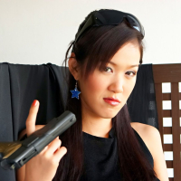 Irene Fah playing with Handguns and caressing her tits