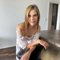 Johanka Jay with natural tits wearing hot lingerie posing in the kitchen