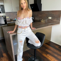 Johanka Jay with natural tits wearing hot lingerie posing in the kitchen