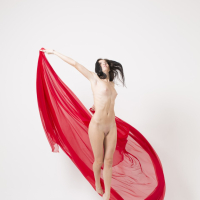 Lovenia Lux gets completely naked while posing erotically