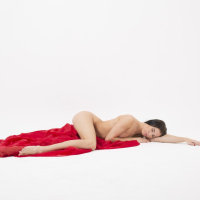 Lovenia Lux gets completely naked while posing erotically