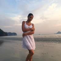 Sweet babe Lovenia Lux posing in a white dress on the beach