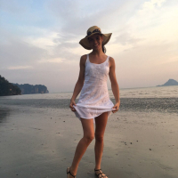 Sweet babe Lovenia Lux posing in a white dress on the beach