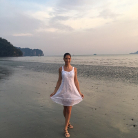 Sweet babe Lovenia Lux posing in a white dress on the beach