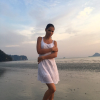 Sweet babe Lovenia Lux posing in a white dress on the beach