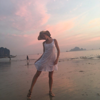 Sweet babe Lovenia Lux posing in a white dress on the beach