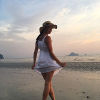 Sweet babe Lovenia Lux posing in a white dress on the beach