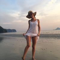 Sweet babe Lovenia Lux posing in a white dress on the beach