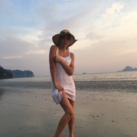 Sweet babe Lovenia Lux posing in a white dress on the beach