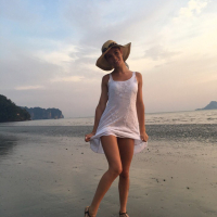 Sweet babe Lovenia Lux posing in a white dress on the beach