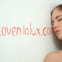 Sweet girl Lovenia Lux showing her nice boobs while posing