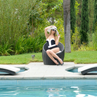 Pretty blonde model Jillian Janson posing naked by the pool
