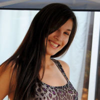 Pretty brunette babe posing in a see through leopard print shirt