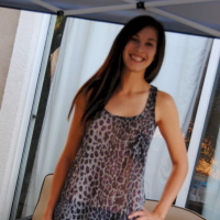 Pretty brunette babe posing in a see through leopard print shirt