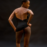 Gorgeous ebony babe Camille removes her clothes and fingers her black pussy