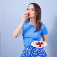 Cute solo chick Maddy Nelson eating a strawberry and spreading legs