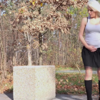 Lucy Shy in black Boots and Skirt peeing outdoors