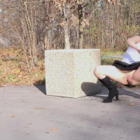 Lucy Shy in black Boots and Skirt peeing outdoors