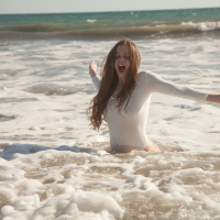 Busty Girl on Beach showing wet Boobs in Swimsuit