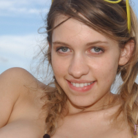 Lovely Girl posing and fingering Twat on the Beach