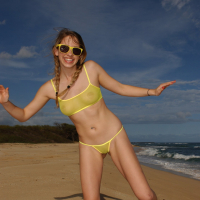 Lovely Girl posing and fingering Twat on the Beach