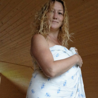 Sexy babe Lady La Perle covers herself with a sheet while posing