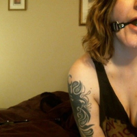 Amazing girl Julia Lennon strips and unveils her nice tits