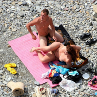 Naked Couple caught fucking on public nude Beach