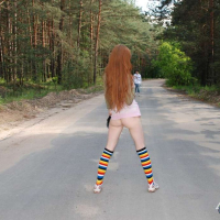 Redhead Chick showing her shaved Pussy in Public