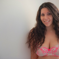 Busty amateur Mallorie playing with her massive tits