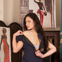 Michelle Khan slowly removes her black dress and lingerie for the camera