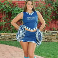 Sexy cheerleader Abby Rocks drops her uniform and spreads legs