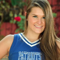 Sexy cheerleader Abby Rocks drops her uniform and spreads legs