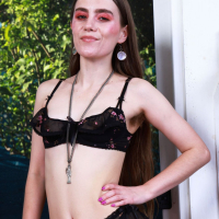 Provocative Sia Wood spreads legs to show her hairy pussy and asshole