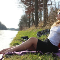 Pretty blonde Sexy Dea unveils her tits and butt outdoors