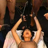 Nasty babe gets chained up and peed all over