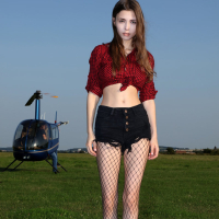 Beautiful Mila Azul posing sexy in a Helicopter
