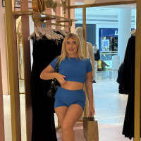Naughty Kylie Ray with hot ass natural tits doing striptease in public