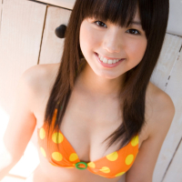 Cute Japanese chick Rina Koike smiles while posing for All Gravure