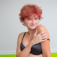 Playful redhead babe Naomi Clark revealing her sexy naked curves