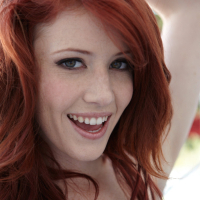 Redhead Elle Alexandra showing her tight shaved Pussy