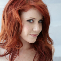 Redhead Elle Alexandra showing her tight shaved Pussy